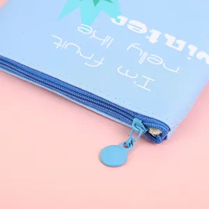 Light blue cartoon zipper coin purse with textured leather and green geometric patterns
