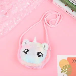 Close-up of rainbow plush unicorn crossbody bag with glitter horn and embroidery
