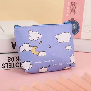 Detail of lavender cartoon coin purse featuring moon and cloud patterns with litchi texture