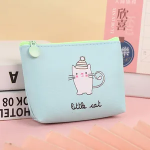 Close-up of a light blue cartoon cat coin purse with green zipper and metal puller