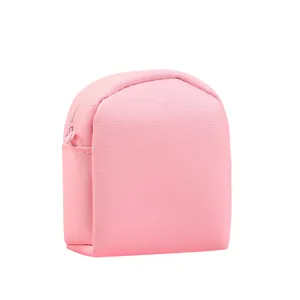Pink heart-shaped mini coin purse in grainy PU leather with smooth metal zipper closure