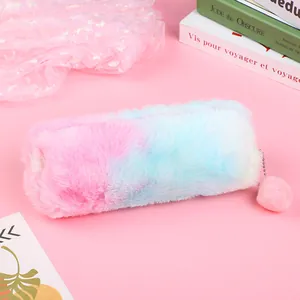 Macro shot of fluffy pink-blue gradient plush pencil case with cute pompom zipper pull