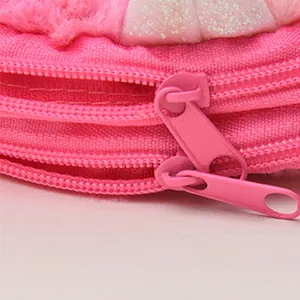 Pink plush unicorn shoulder bag for girls featuring dual zippers and sparkling accents