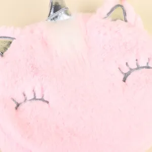 Detail of pink plush unicorn bag showing soft faux fur and silver horn embroidery