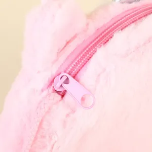 Detail of pink plush bag showing fuzzy faux fur texture and a secure zipper closure