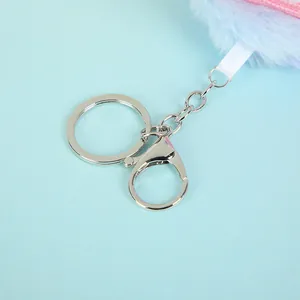 Detail of silver metal lobster clasp and key ring with gradient plush pendant detail