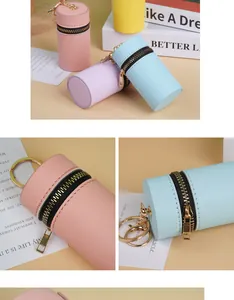 Détails de ce porte-monnaie cylindrique en cuir PU avec texture croisée et fermoir doré