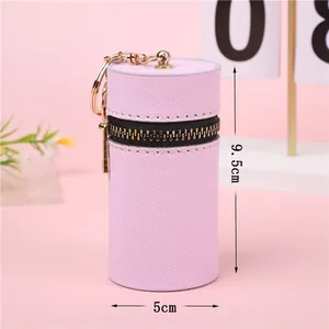 Mini borsa rotonda in pelle rosa per rossetto e chiavi con dettagli dorati