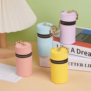 Mini porte-monnaie cylindriques en similicuir en quatre couleurs avec porte-clés dorés