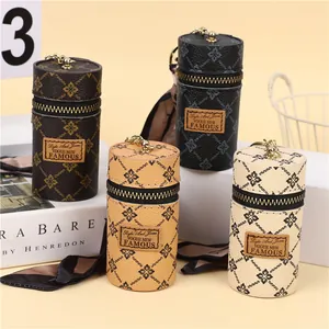 Mini cylindrical bucket coin purses with vintage floral patterns and metal hooks