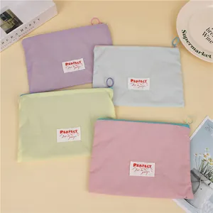 Waterproof travel cosmetic bags in macaron colors with large capacity and round zip pulls