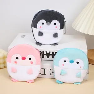 Plush penguin coin purse keychains in three colors with silver chains and zip closures