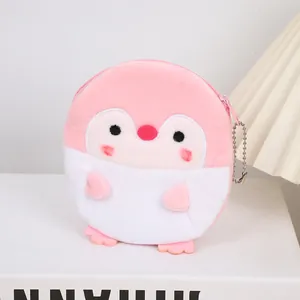 Detailed view of pink penguin plush coin purse with embroidery and metal chain hook