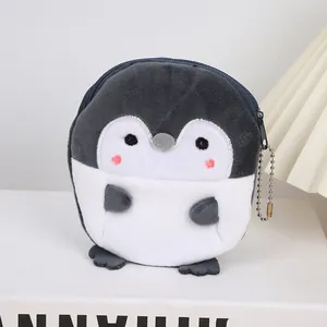 Detail of plush cartoon penguin coin purse with zipper closure and silver bead chain