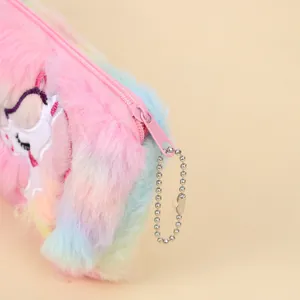 Close-up of rainbow tie-dye plush fabric with unicorn embroidery and pink zipper