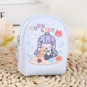 Mini canvas backpack coin purse in light blue with cartoon beach scene and GOOD LUCK text