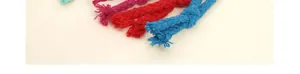 Detail of woven plaid cords in blue red and magenta colors for cosmetic pouches