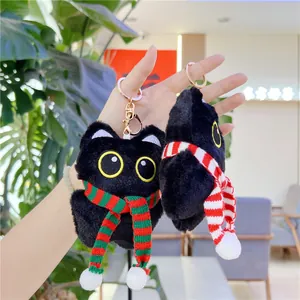 Cute black cat plush keychain with colorful striped scarf and golden metal clip