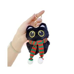 Cute black cat plush keychain with yellow eyes and red-green scarf for bag decoration