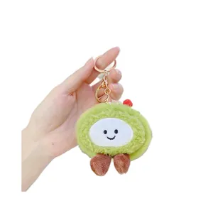 Plush matcha strawberry cake keychain with cute smiling face and rose gold clasp