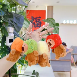 Capybara plush keychain in avocado and fruit costumes with golden metal clasp