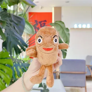 Detail of creative peanut plush doll with funny facial expression and soft brown fabric