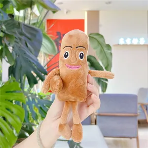 Detailed embroidery on a brown plush charm featuring a unique humanoid face design