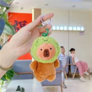 Detailed view of Capybara plush keychain wearing an avocado costume with a silver ring