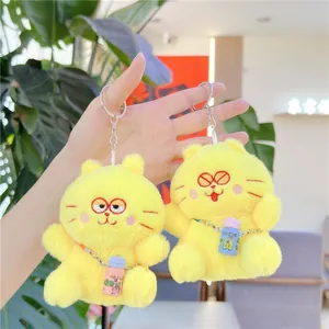 Set of two yellow plush cat keychains with mini drink bottles and metal chains