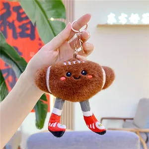Close-up of American football plush keychain with cute face and sporty shoes detail