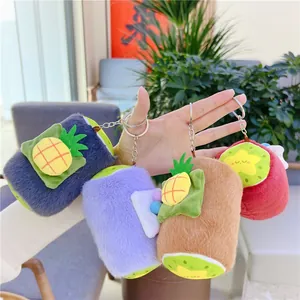 Cute fruit-themed plush beverage cup keychains with pineapple and kiwi cartoon designs