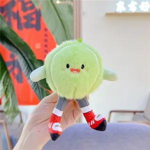 Detailed close-up of a cute green plush ball doll with sneakers as a bag charm hanging