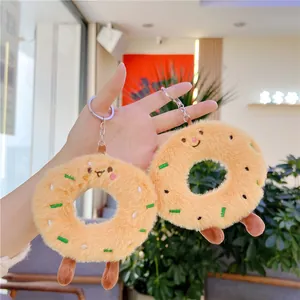 Set of cute plush doughnut keychains with embroidered faces and silver metal rings