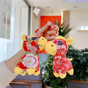Traditional Chinese red plush horse pendant with floral patterns and bead decoration