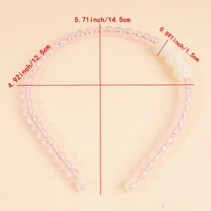 Pink beaded headband with pearl accents and detailed size measurements in centimeters