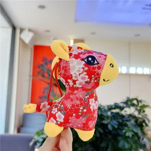 Detail of red Chinese zodiac horse plush with floral patterns and hanging strap for gift