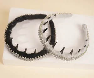 Detail showing non-slip plastic teeth and sparkling rhinestones on plush headbands