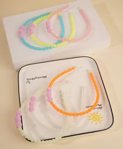 Detailed close-up of 6PCS colorful beaded headbands in blue, yellow, pink and white