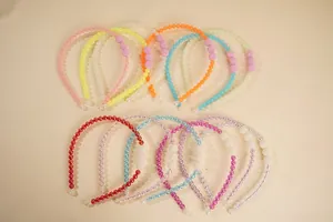Detail of colorful beaded headbands with large decorative matte beads and soft protective ends