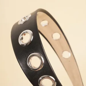 Fashionable black PU leather wide headband with hollow silver metal eyelets for women