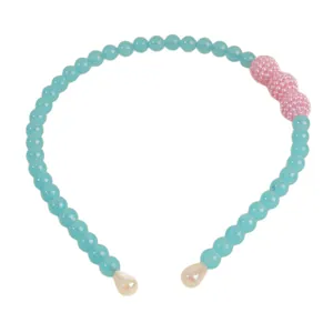 Minimalist light blue beaded headband with pink accents and pearlized teardrop tips