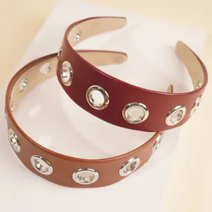 Fashionable PU leather headbands in burgundy and brown with silver eyelet details