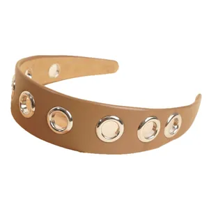Brown PU leather headband with silver metal grommets on a clean white background