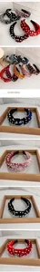Detail of beaded velvet knot headbands in multiple colors featuring white faux pearls