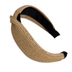 Natural woven raffia headband with stylish top knot design in light brown finish