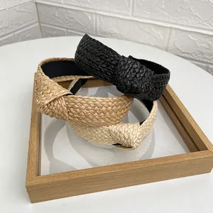 Cerchietti in rafia intrecciata a mano in nero beige e marrone su cornice in legno