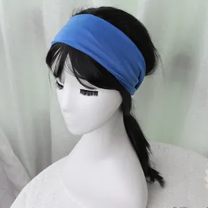 Detail of navy blue elastic sports headband on model showing width and snug fit