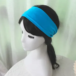 Detail of bright blue elastic sports headband on a model showing soft texture