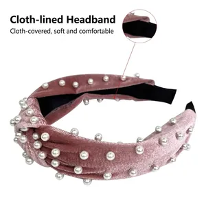 Pink velvet knotted headband with white pearls and soft black fabric inner lining