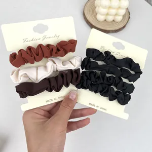 Set di 3 elastici per capelli in tessuto a coste color caramello, crema e marrone